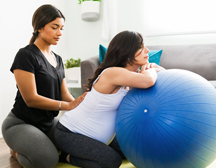 two people with exercise ball 