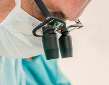 doctor looking through glasses