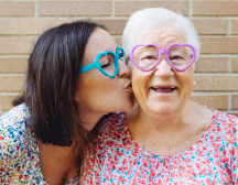 two adults looking at camera