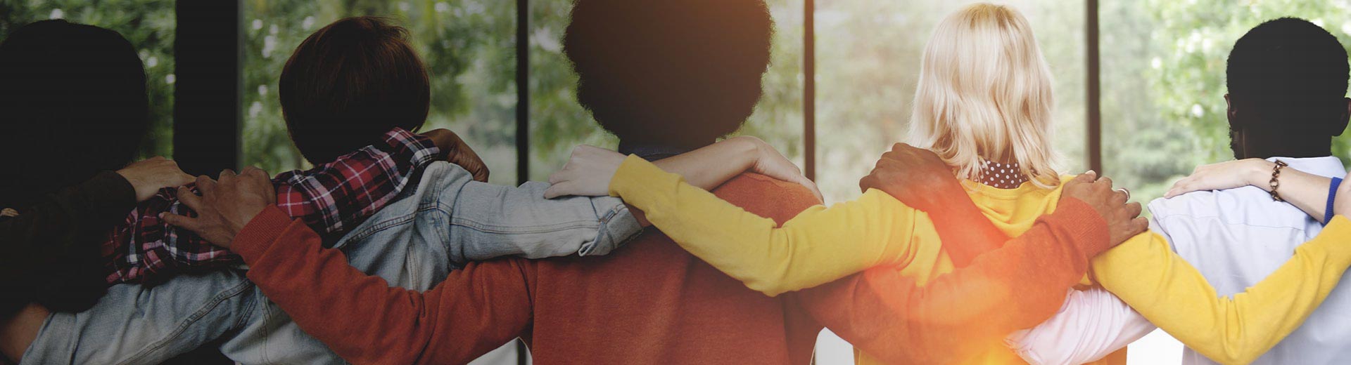 a line of people with their hands on each others shoulders