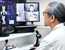 doctor looking at computer screen 